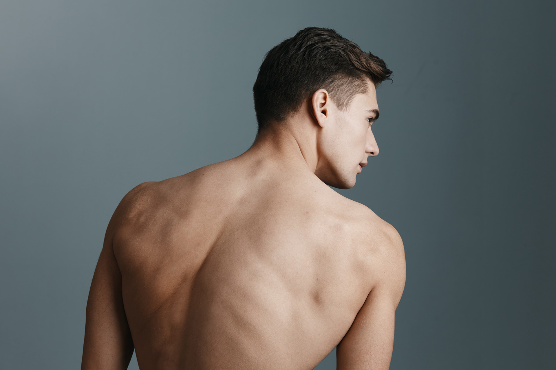 sexy-man-with-a-naked-back-looks